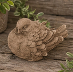 Rustic Brown Bird Dove Concrete Garden Statue perched on a wooden surface.