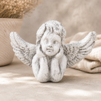 whitewashed rustic Statue of an angel with outstretched wings on a neutral background